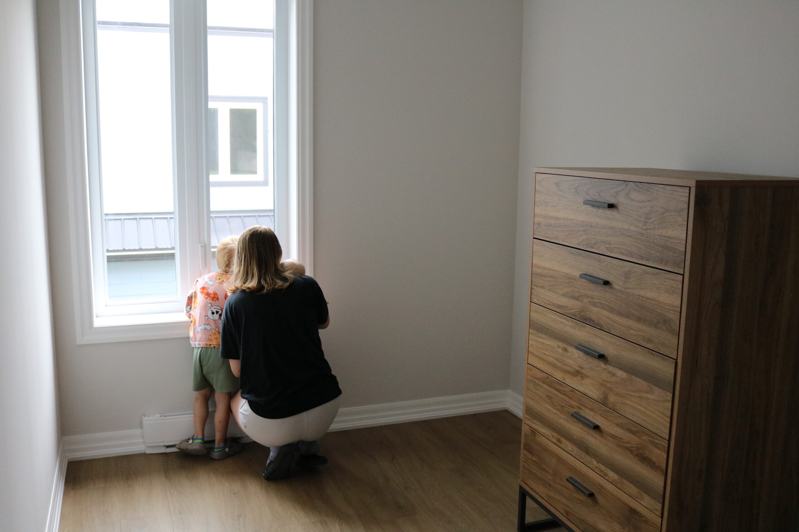 Mother and son enjoying the view from their new home